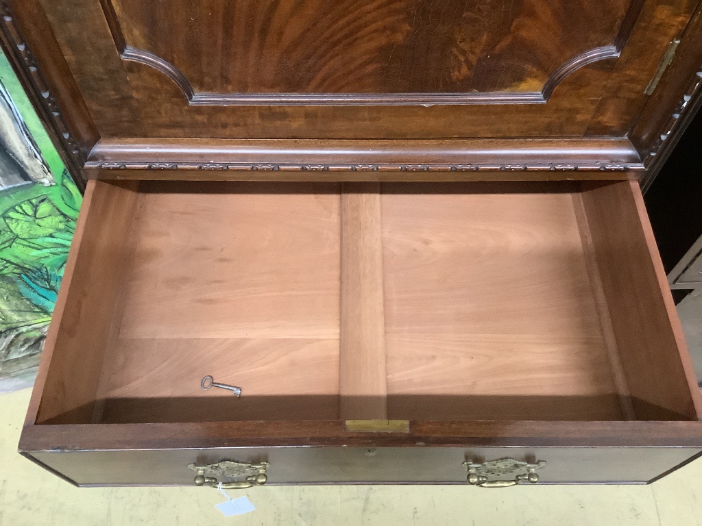 An early 20th century mahogany Chippendale Revival linen cabinet, width 73cm depth 50cm height 198cm